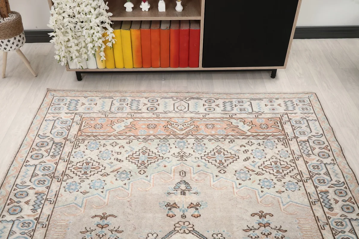 Room view of the rug, focusing on the upper half and its placement relative to a console table