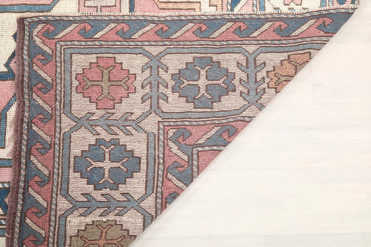 Underside view of the rug showing the tight hand-knotted construction and weaving