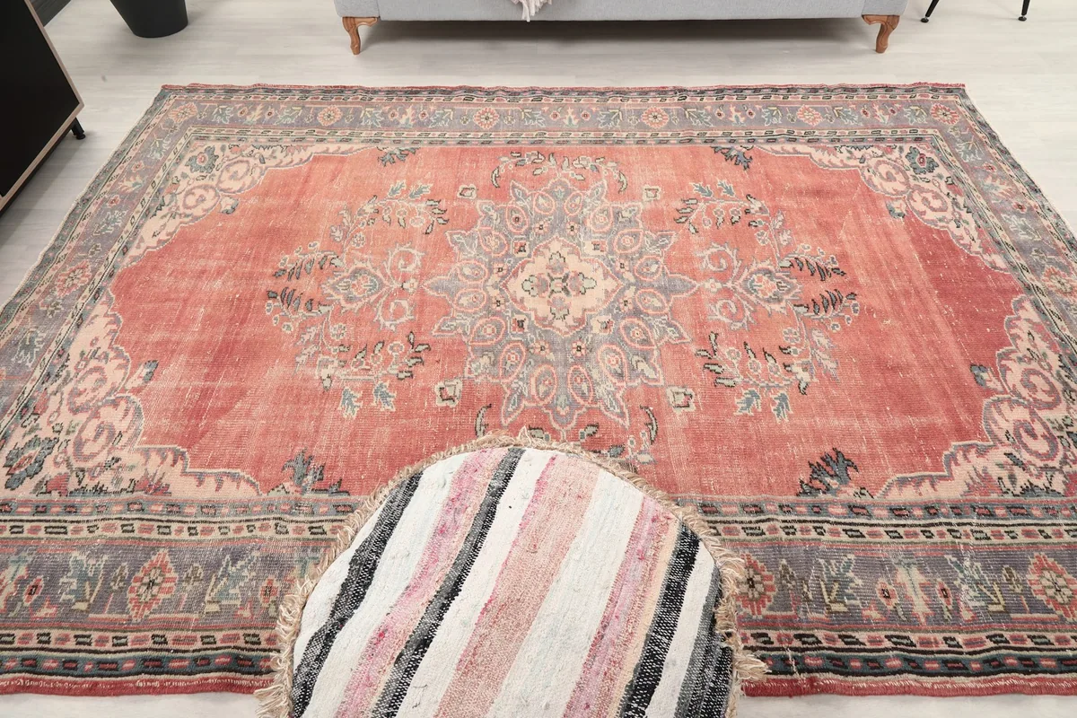 Straight-on view of the rug on the floor, showcasing the full medallion and border design.