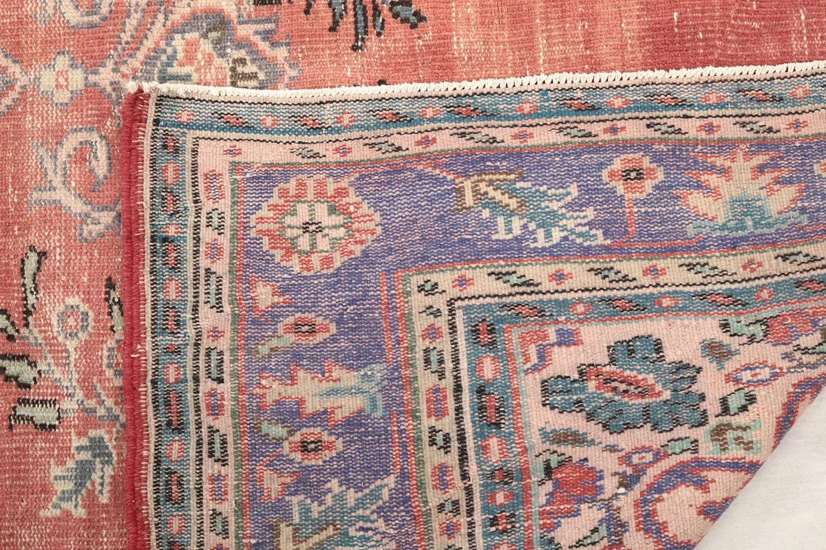 Close-up of the low wool pile and intricate knotting from the back of the rug.