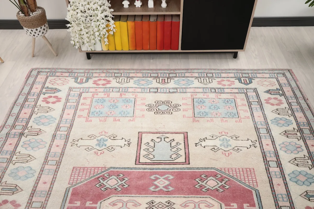 View of the rug in a room, highlighting its full design and color palette