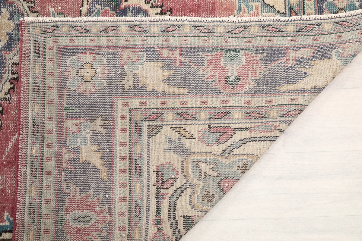 Close-up of the Faded Rose Medallion Anatolian Rug's low wool pile and the intricate knotting visible from the back