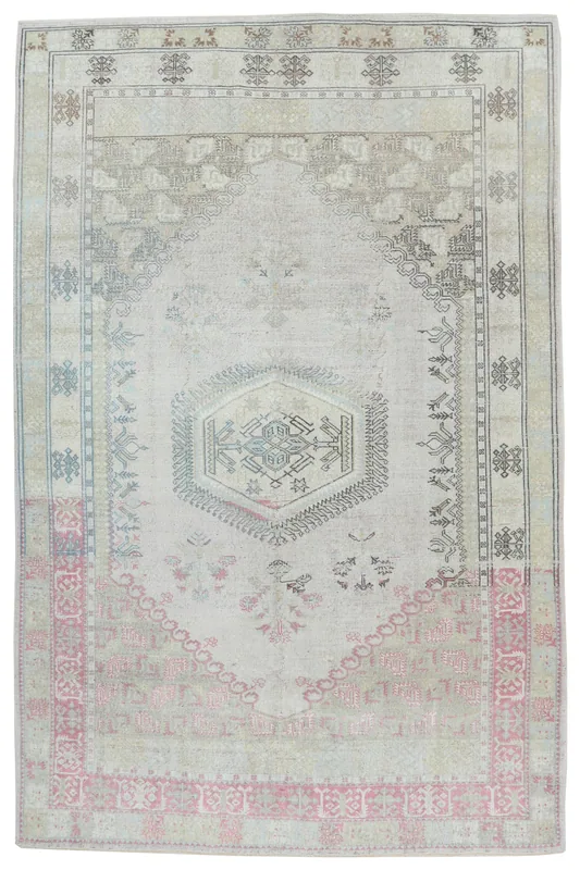 Full overhead view of the beige and rose vintage Anatolian rug with a central medallion