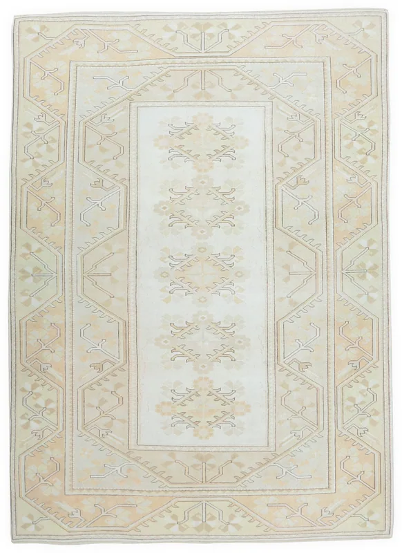 Full overhead view of the vintage cream and beige geometric Anatolian rug