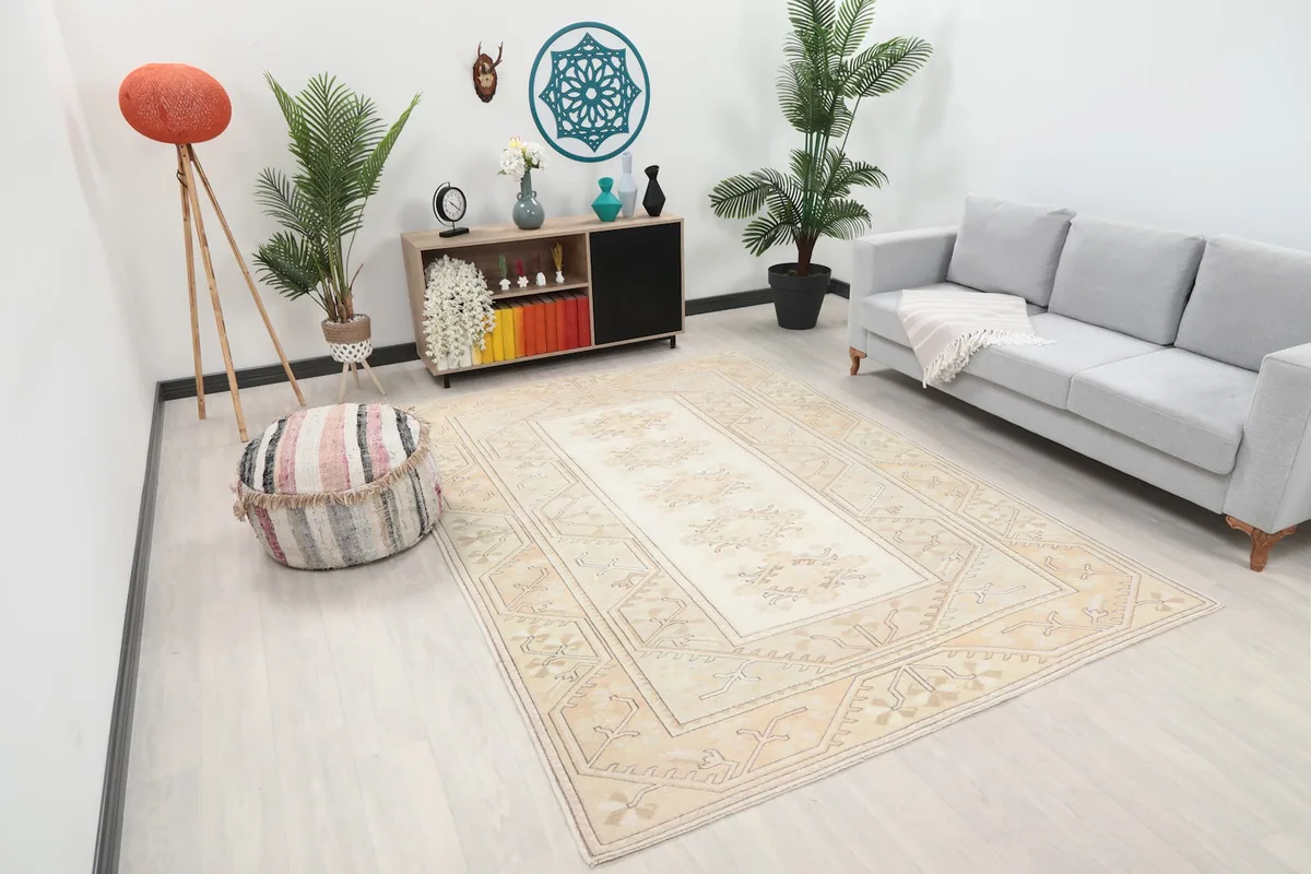 Angle view of the Anatolian rug in a room with a sofa and decor
