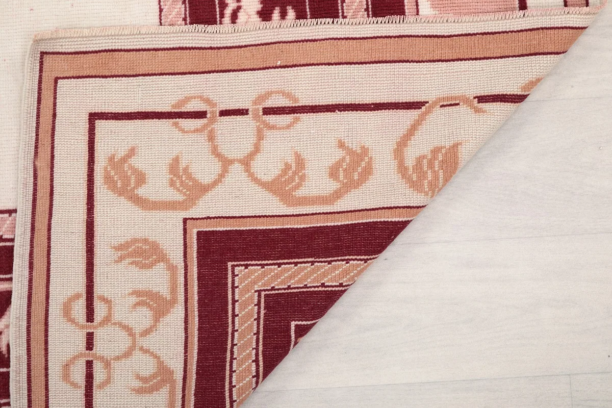 Close-up of the rug's low pile and the hand-knotted texture