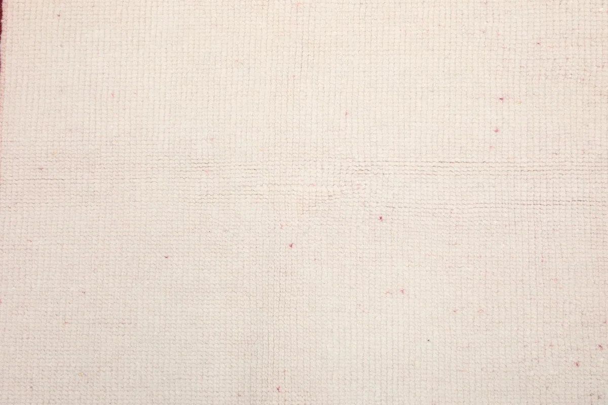 Back of the hand-knotted rug showing the cotton foundation weave