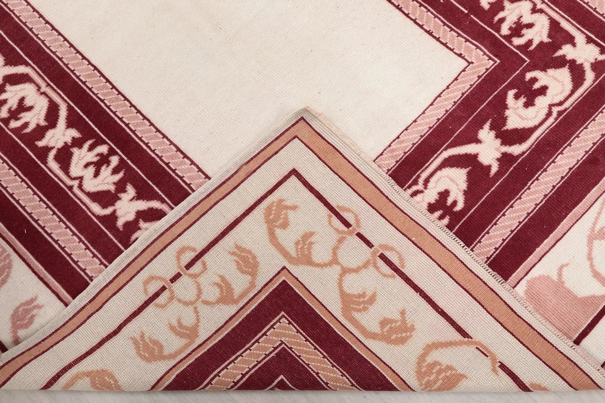 Folded corner of the rug revealing the pile and construction detail