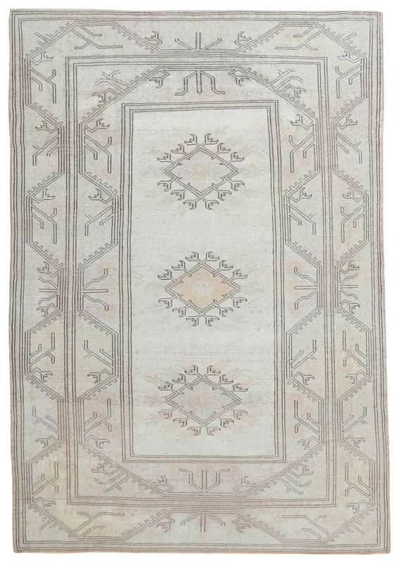 Full top view of the ivory and tan geometric vintage Anatolian area rug