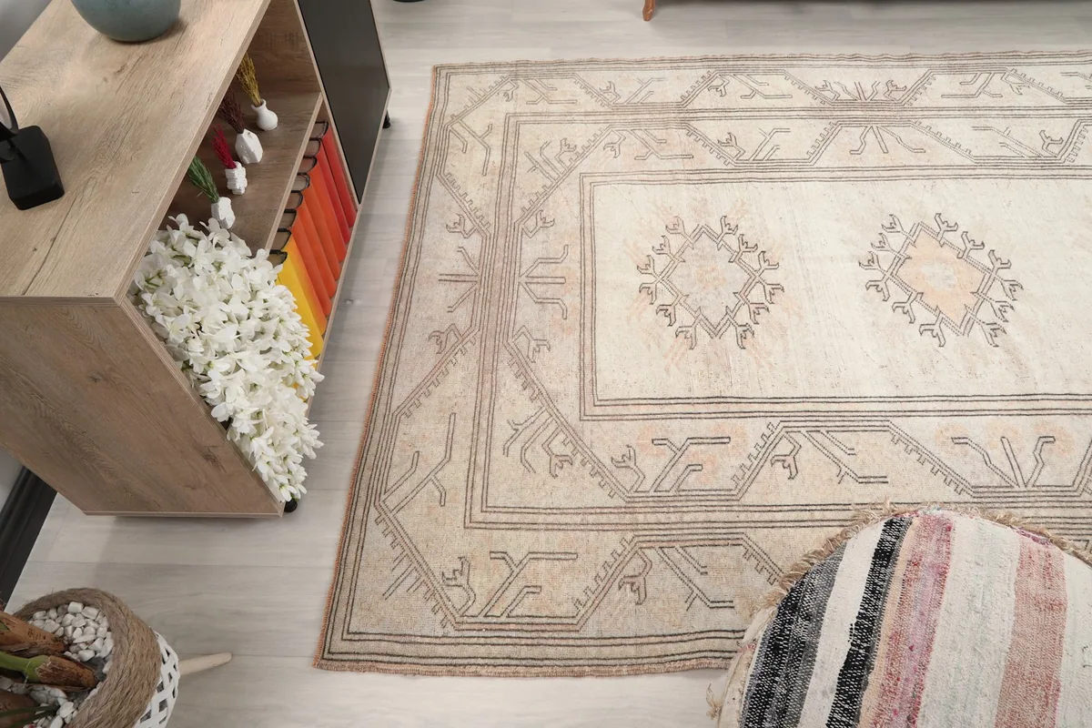 Overhead angle shot of the rug, focusing on the patterns and overall layout within a room