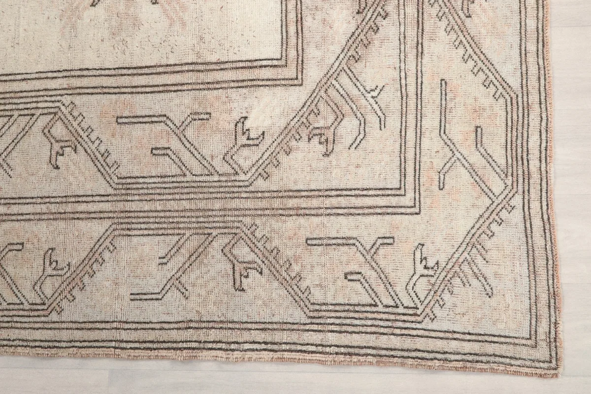Detail of the geometric pattern along the border of the vintage Anatolian rug