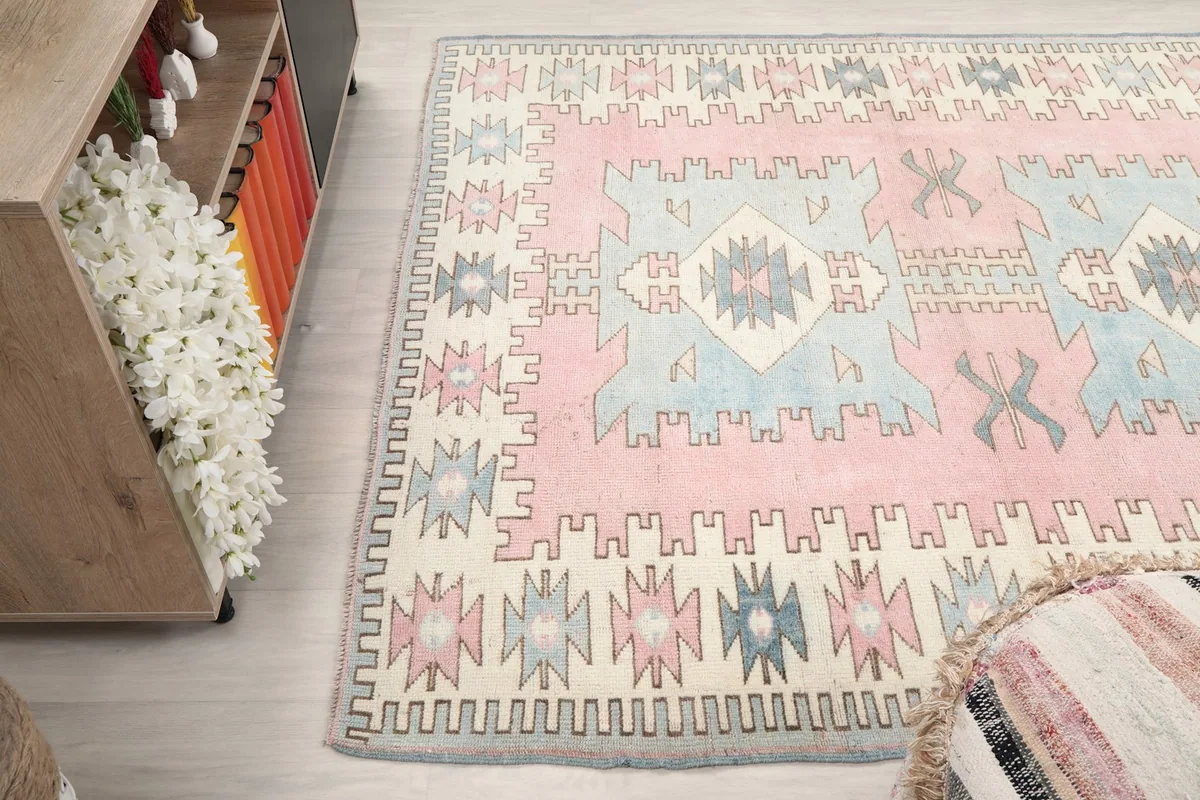 Wide angle shot of the rug's full pattern and colors from a slightly elevated perspective