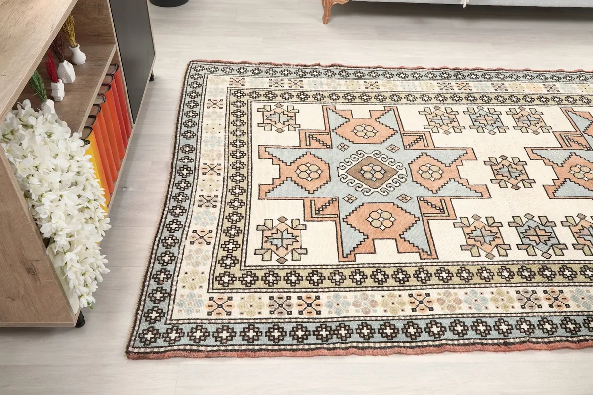 Angled shot of the rug's side, extending into the room
