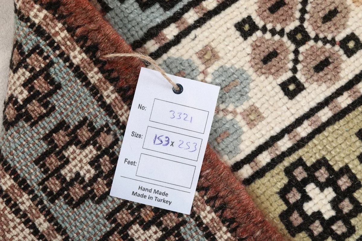 Tag showing the rug's dimensions (153 x 253 cm) and origin from Turkey