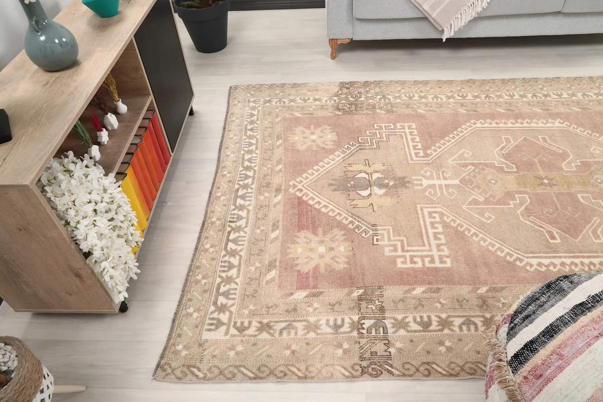 Angled view of the rug in the room, showing its overall shape and design from above