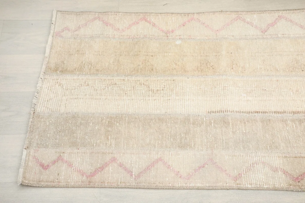 Detailed view of the rug's pattern and color transitions from a slight angle