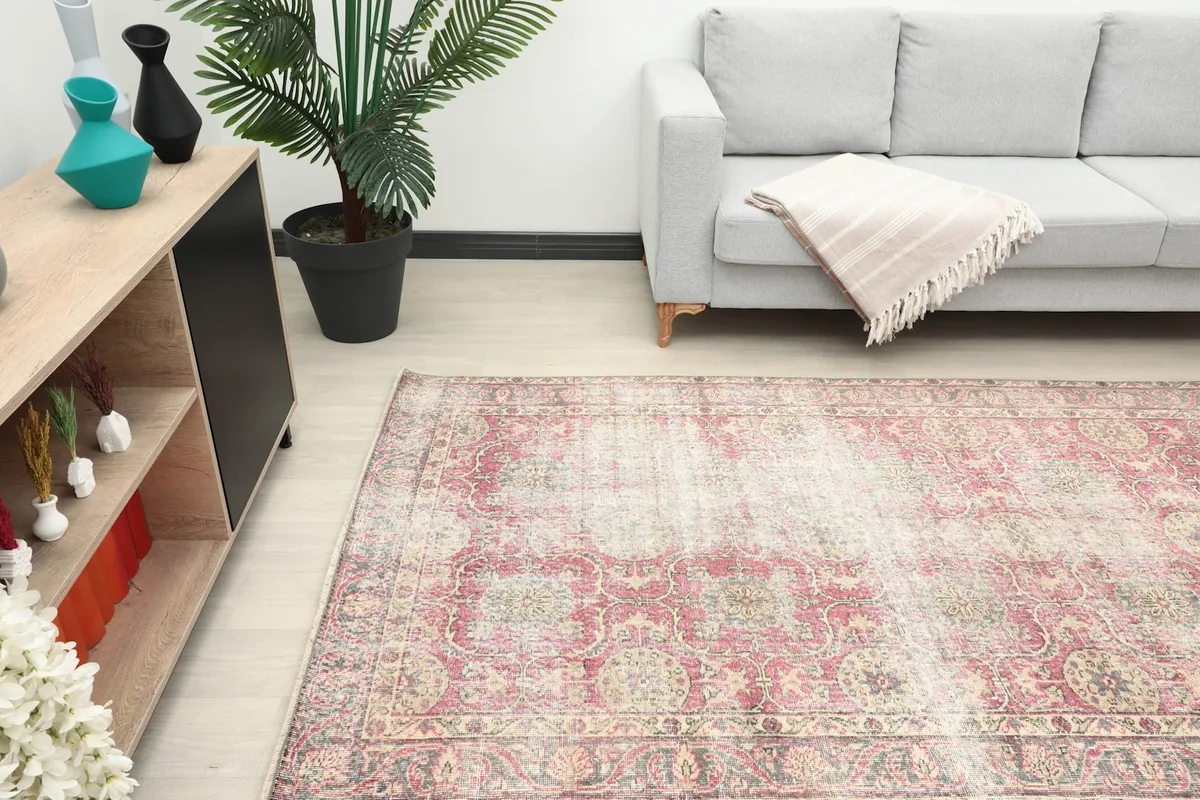 Overhead view of the vintage rug in a room, highlighting its placement and scale