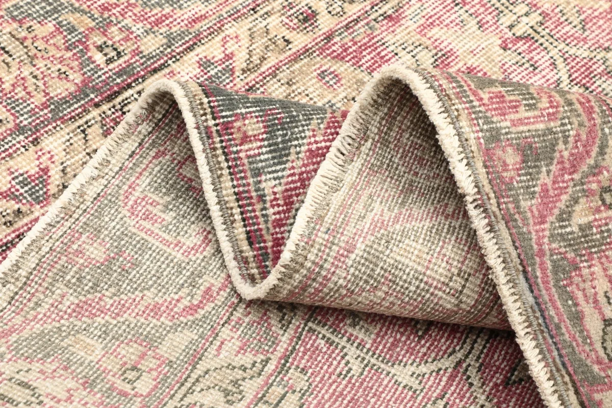 Folded section of the rug, showing the density of the hand-knotted wool pile