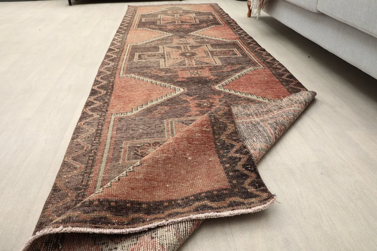 Partial roll of the runner rug, showing its flexibility and full length