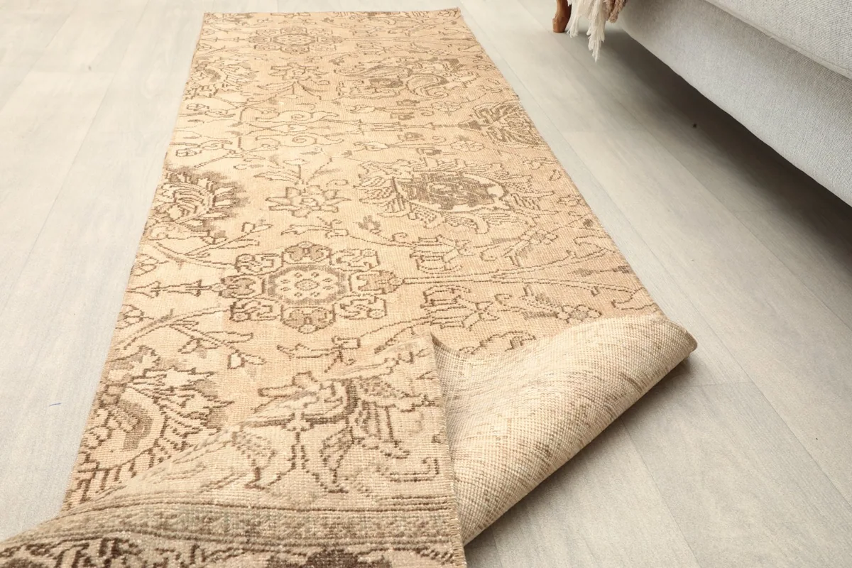 The runner partially unrolled on the floor, showing its flexibility and the overall pattern flow.