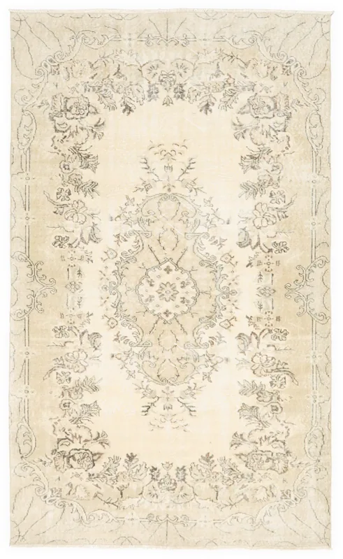 Full overhead view of the ivory and gray vintage Anatolian rug on a white background.