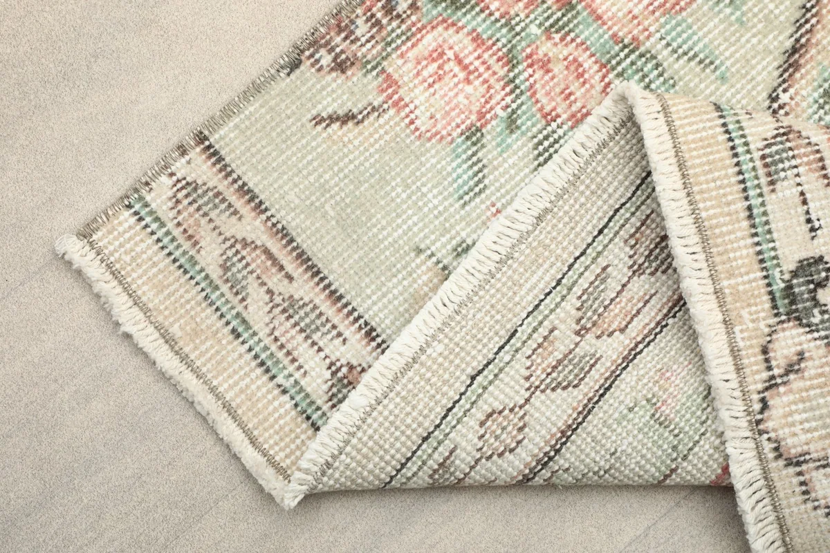 View of the rug's back showing the cotton foundation and tight hand-knotting