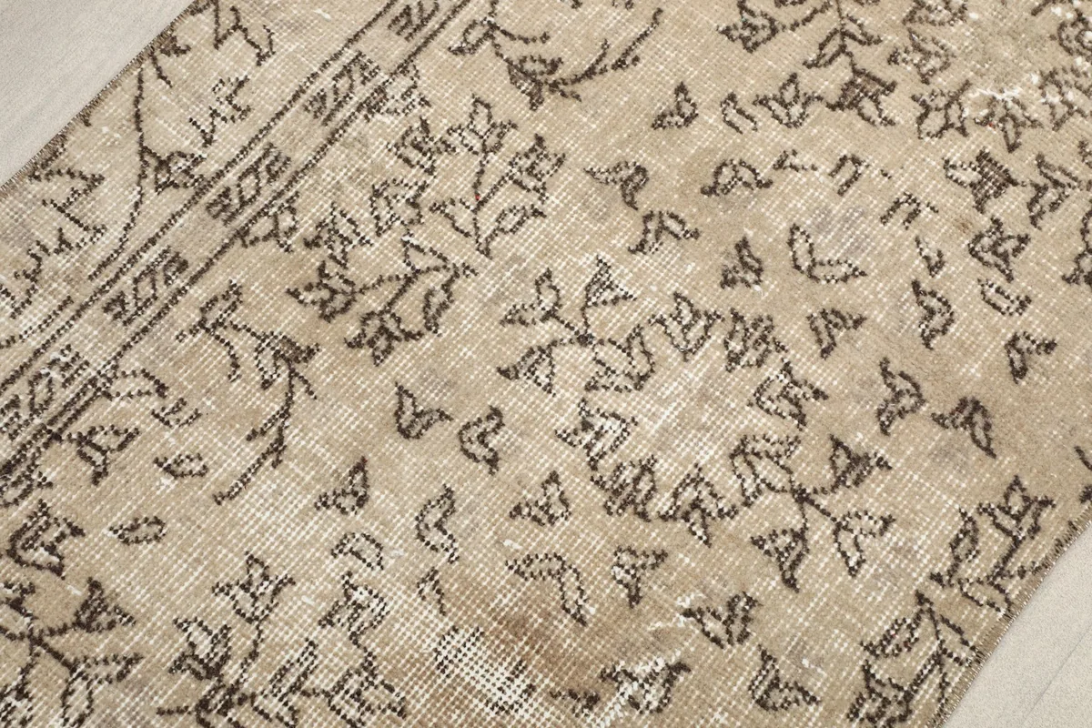 Close-up of the low wool pile and hand-knotted texture of the vintage runner