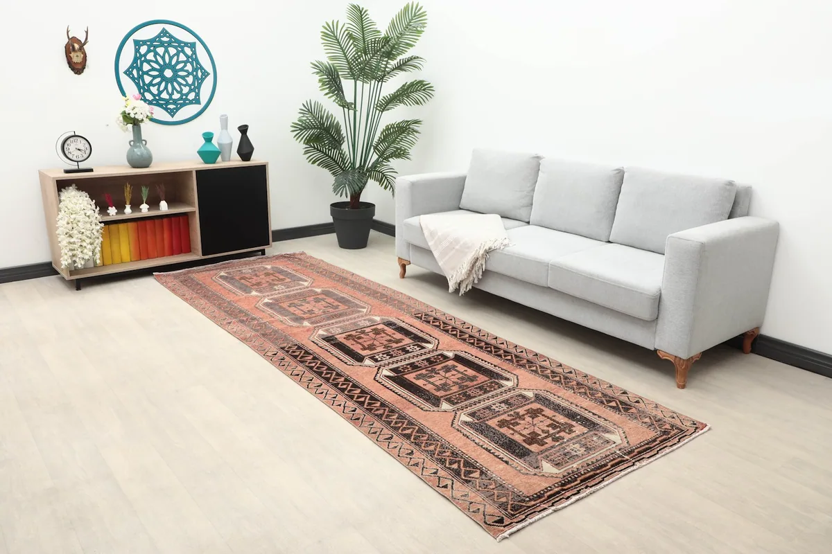 Vintage Anatolian runner rug displayed in a living room setup, enhancing the space.