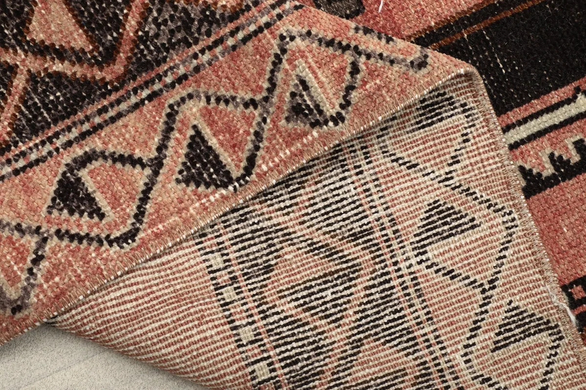 Underside of the hand-knotted rug, revealing the cotton foundation and construction.