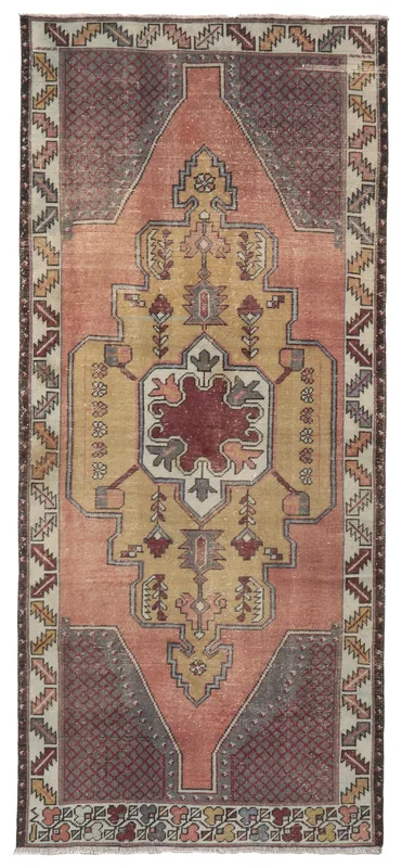 Full top view of the vintage Anatolian rug with rose and gold colors