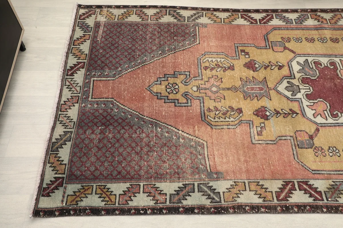 Close-up of the rug's right side, highlighting the geometric patterns and colors