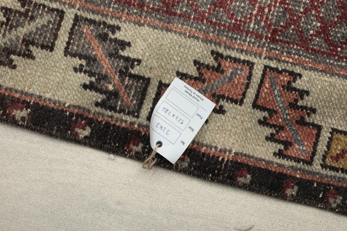 Close-up of the rug's corner with the product tag visible
