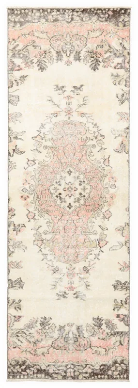 Full overhead view of the vintage Anatolian runner rug with ivory field and rose medallion