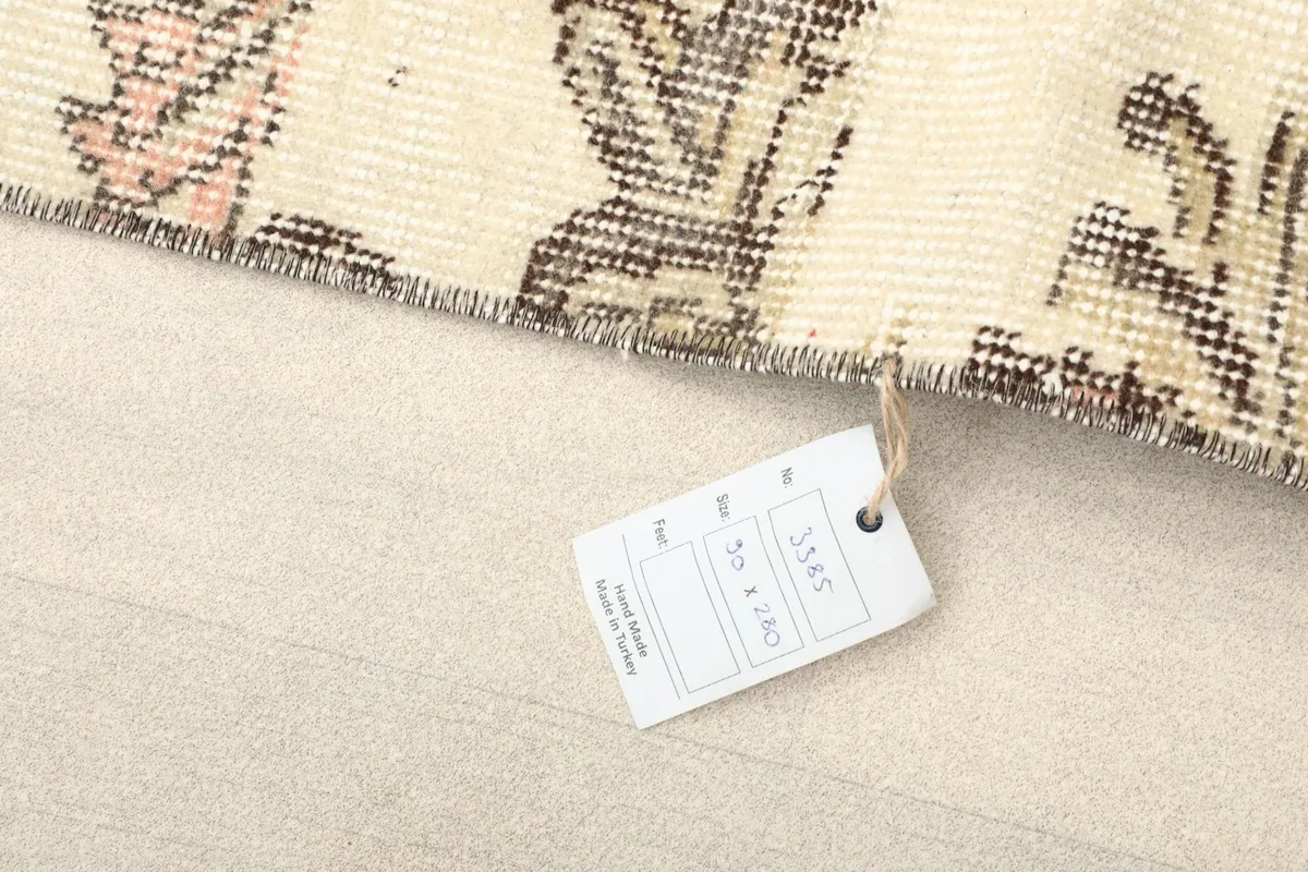 Corner of the rug with the product tag displaying item information