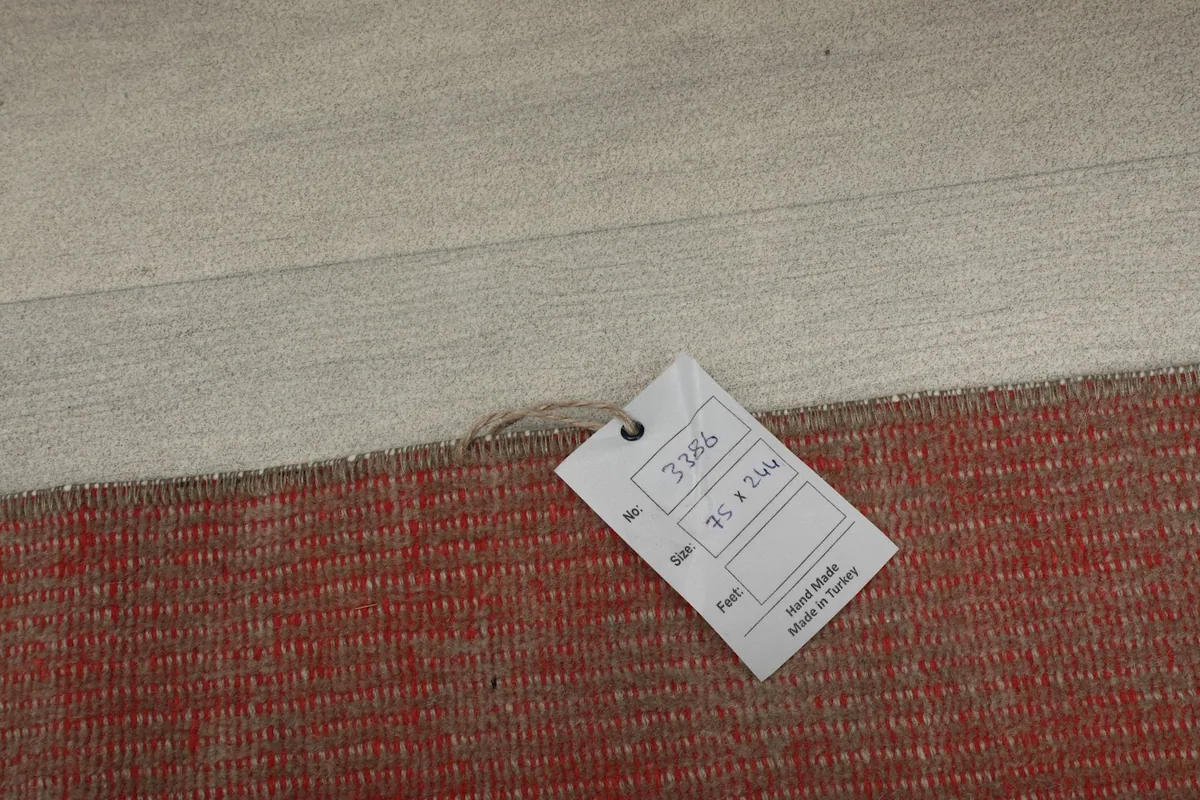 Rug tag showing size 75 x 244 cm and origin Anatolia, Turkey.