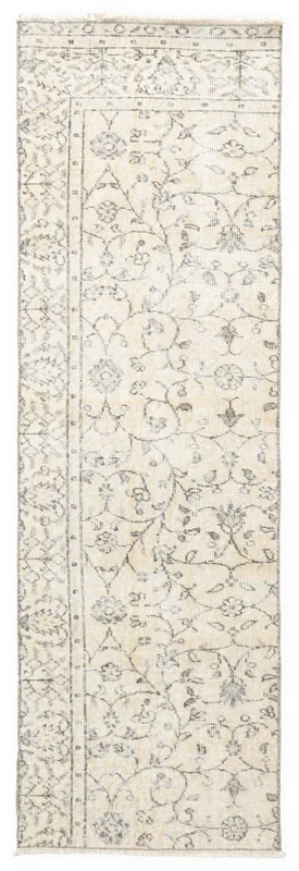 Full top view of the 2x7 vintage runner rug with beige field and charcoal floral patterns