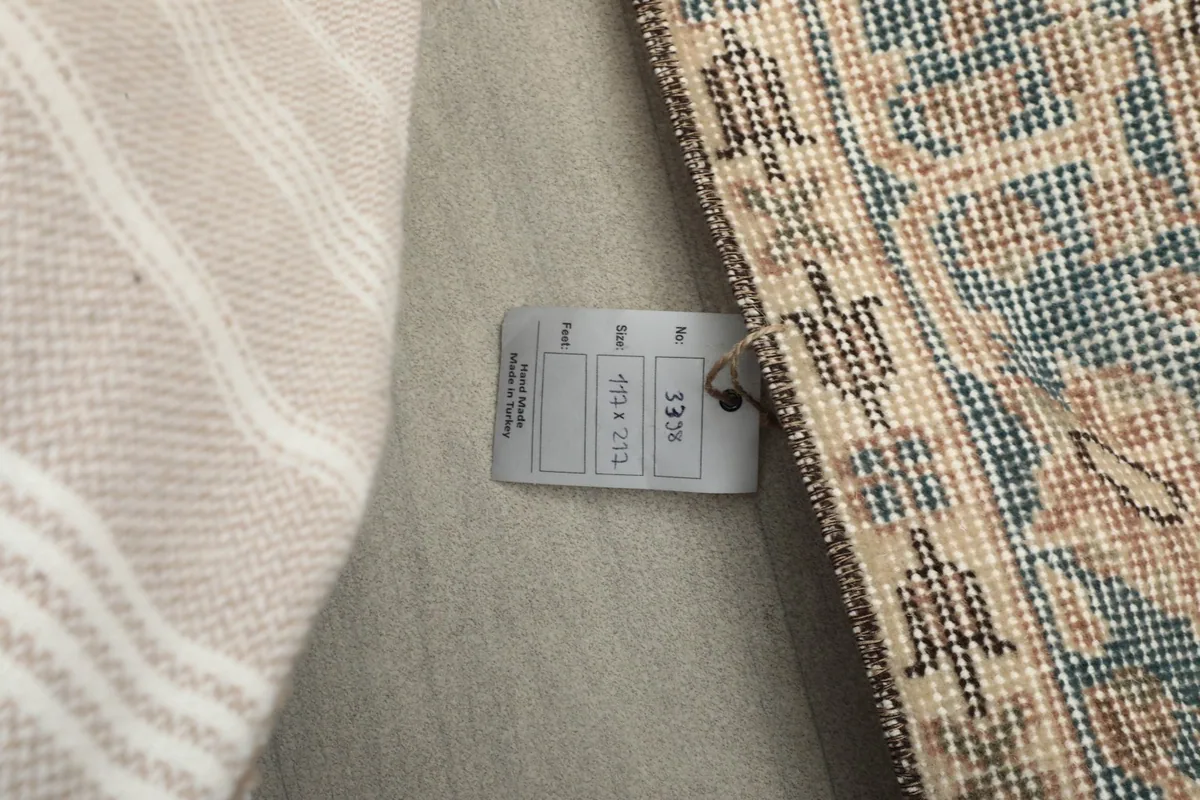 Photo showing the product tag with rug dimensions and origin details