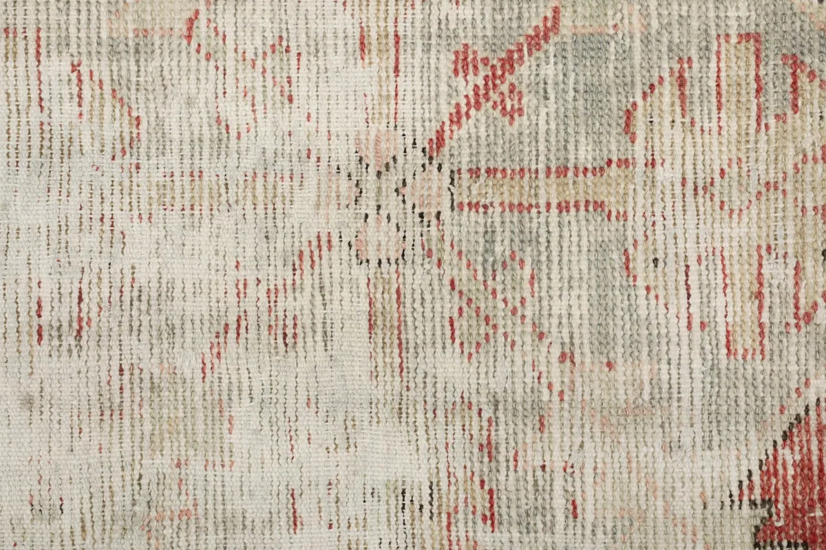 Extreme close-up of the low wool pile, showing individual fibers and the subtle color variations.