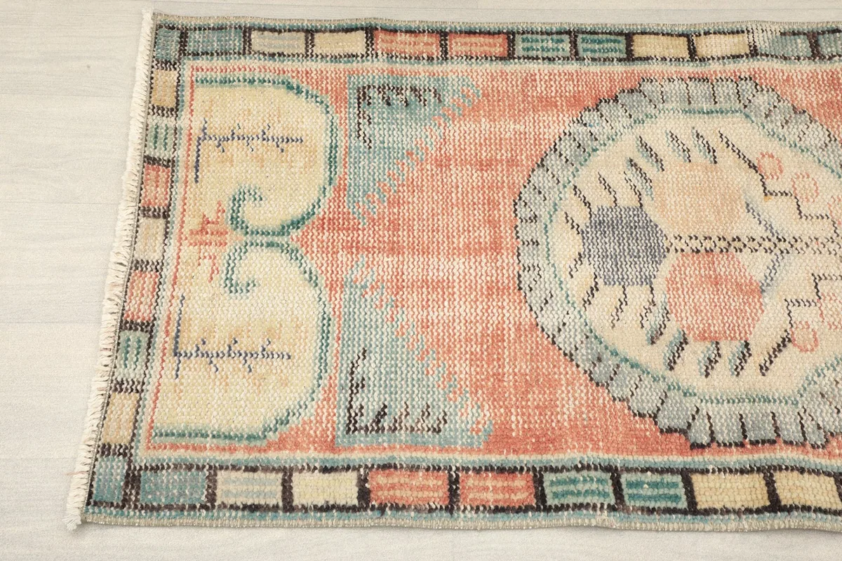Close-up of the lower section, showing the colorful border and geometric patterns