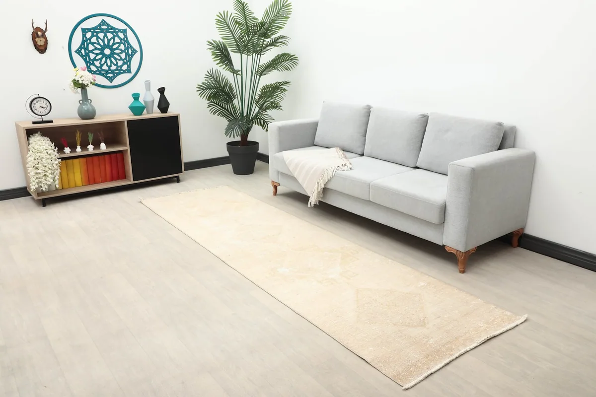 Overall room view featuring the ivory runner rug, complementing the neutral decor and natural light