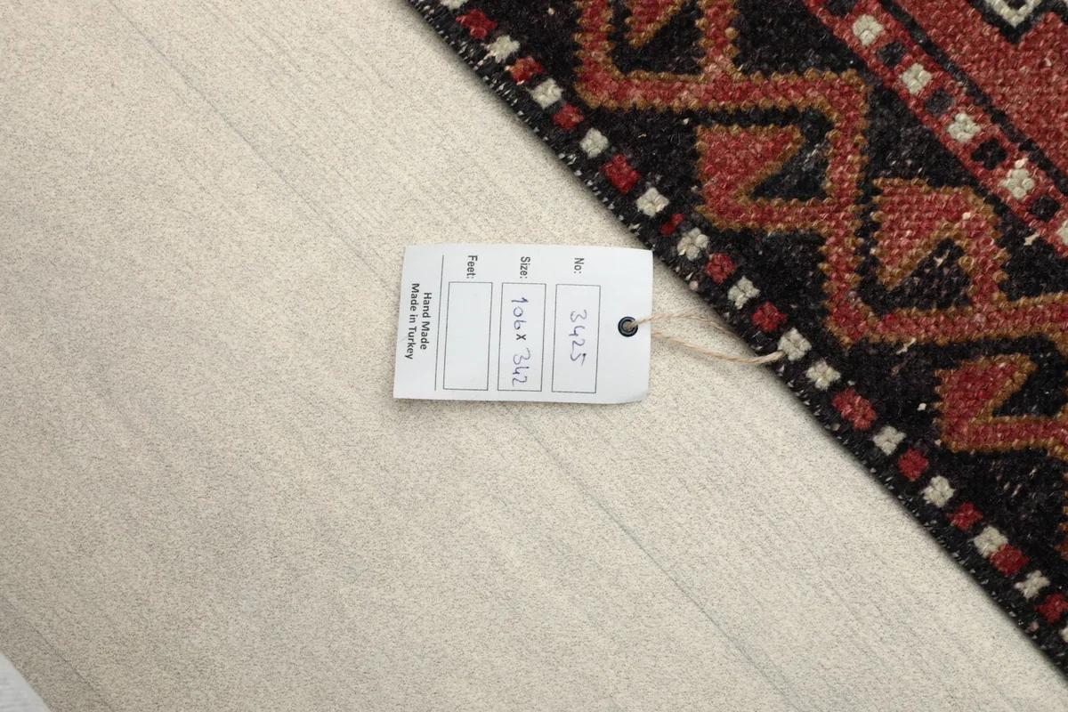 Close-up of the product tag attached to the corner of the rug