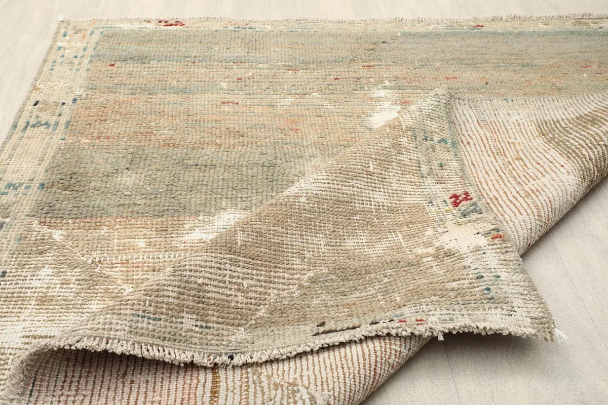 Another perspective of the rug's folded edge, showcasing its construction