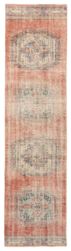 Full overhead view of the vintage Anatolian runner rug with rust field and geometric medallions.