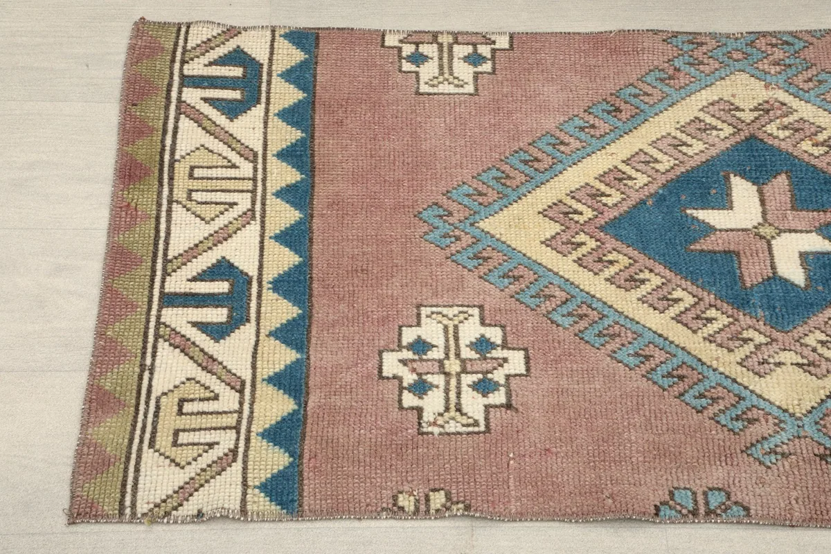 Close-up of the upper left section, showing the intricate geometric motifs and color variations.