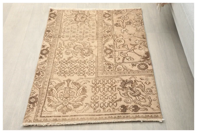 Full overhead view of the beige and brown vintage Anatolian rug