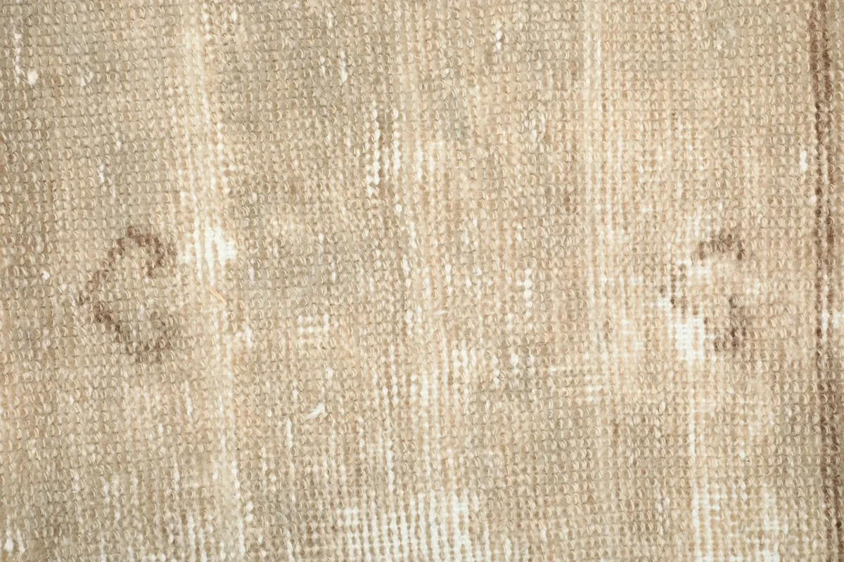 Close-up showing the low wool pile and hand-knotted texture of the vintage runner