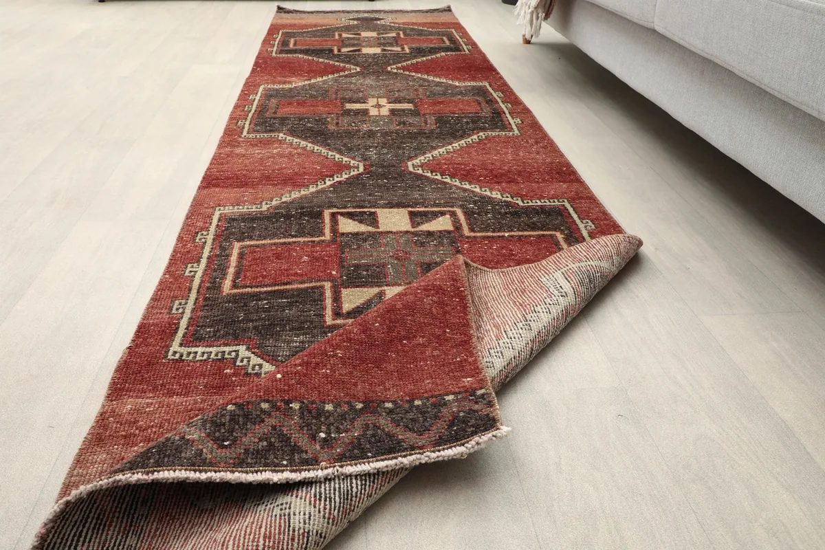 View showing the low pile texture and the aged patina of the vintage hand-knotted wool runner