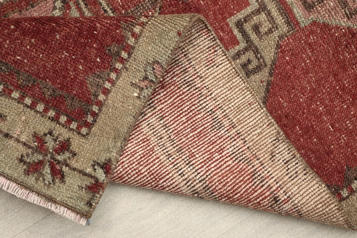 Underside of the hand-knotted rug, revealing the cotton foundation and construction.
