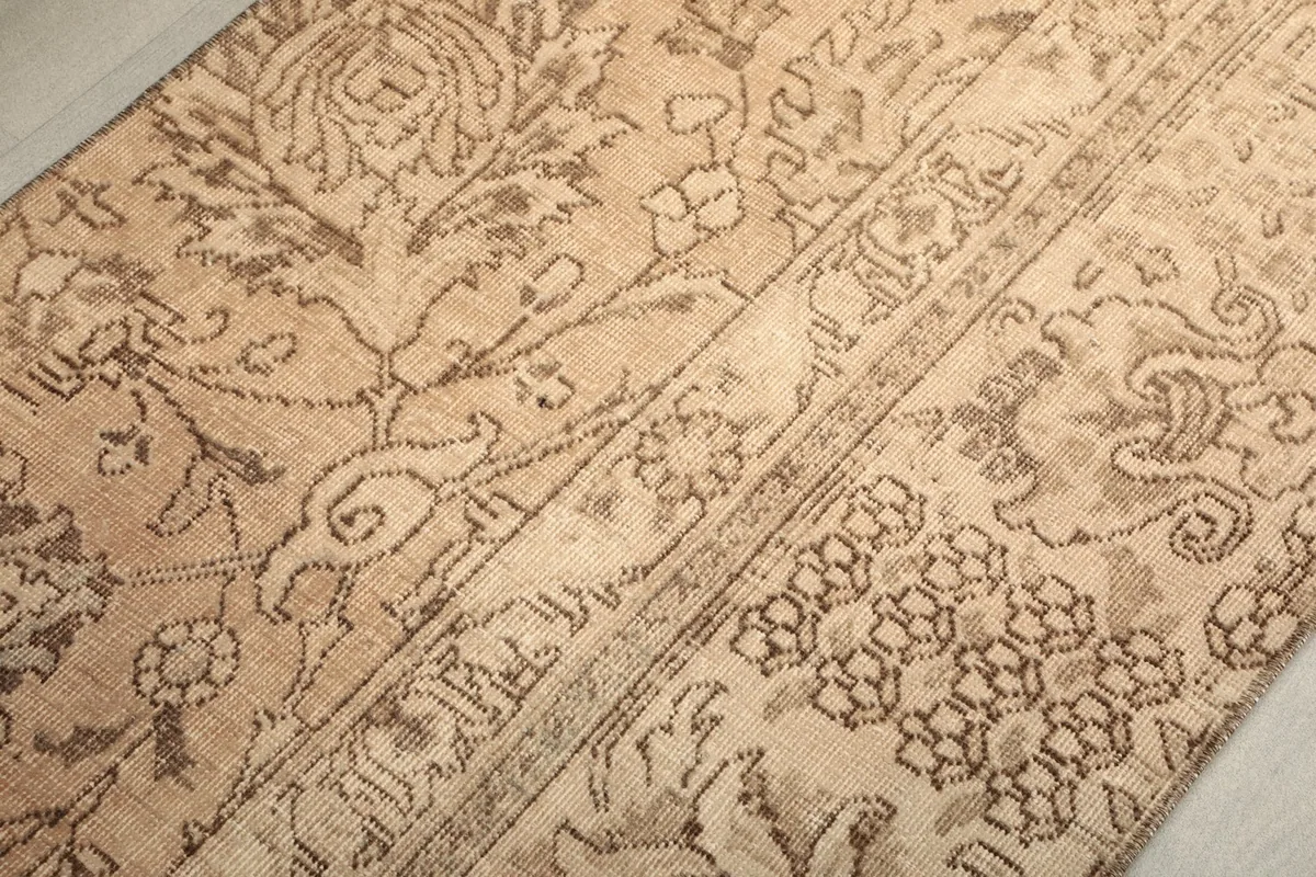 Angled close-up of the runner's surface, revealing the low pile and textured wool.