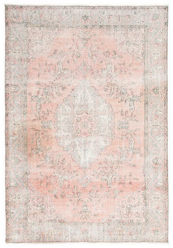 Full overhead view of the rose and gray vintage Anatolian rug with a central medallion